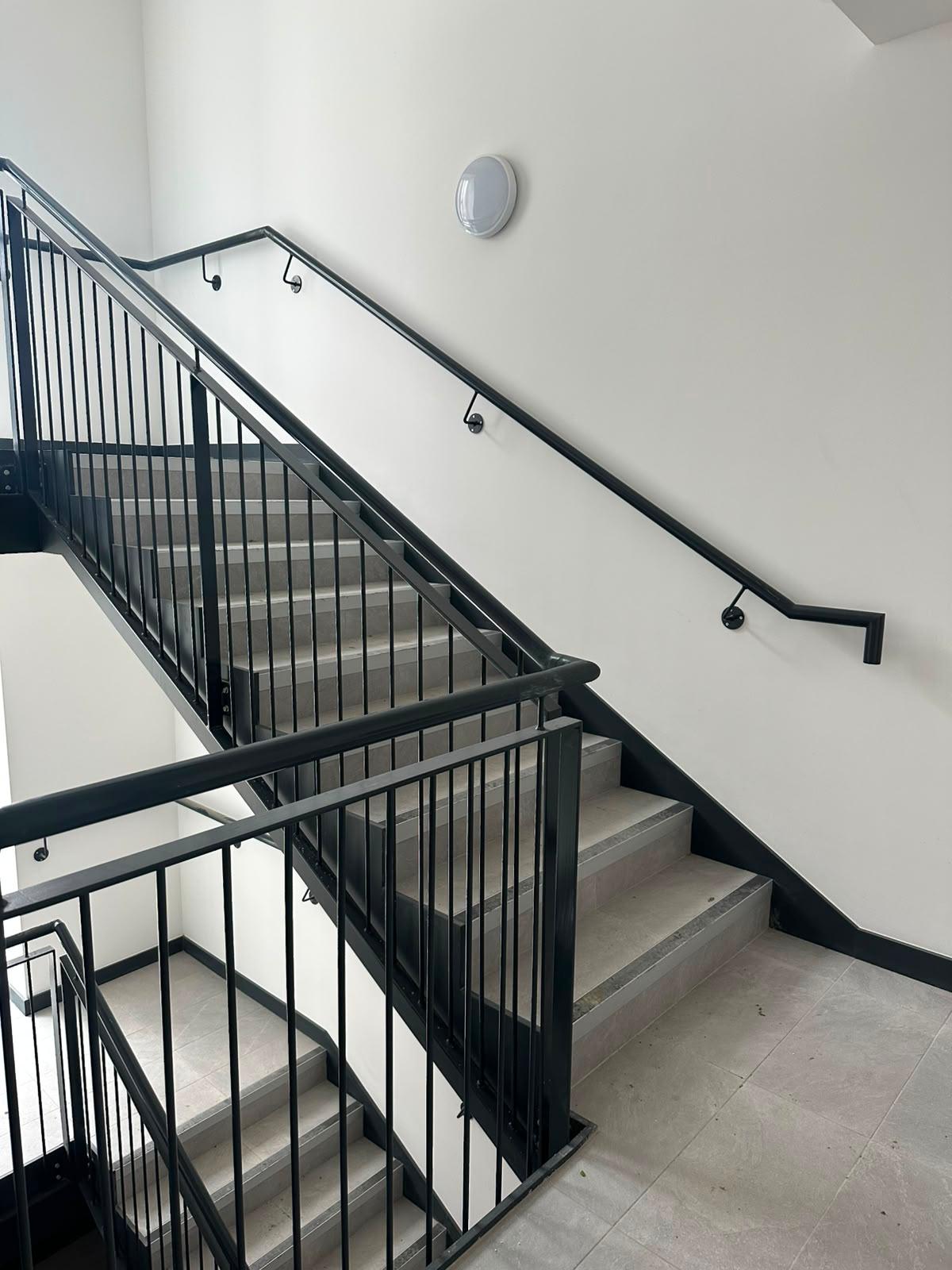 Stair balustrade panels to a full flight of commercial stairs